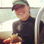 Nikkie with crown conch (and egg casing), found in Apalachicola Bay.