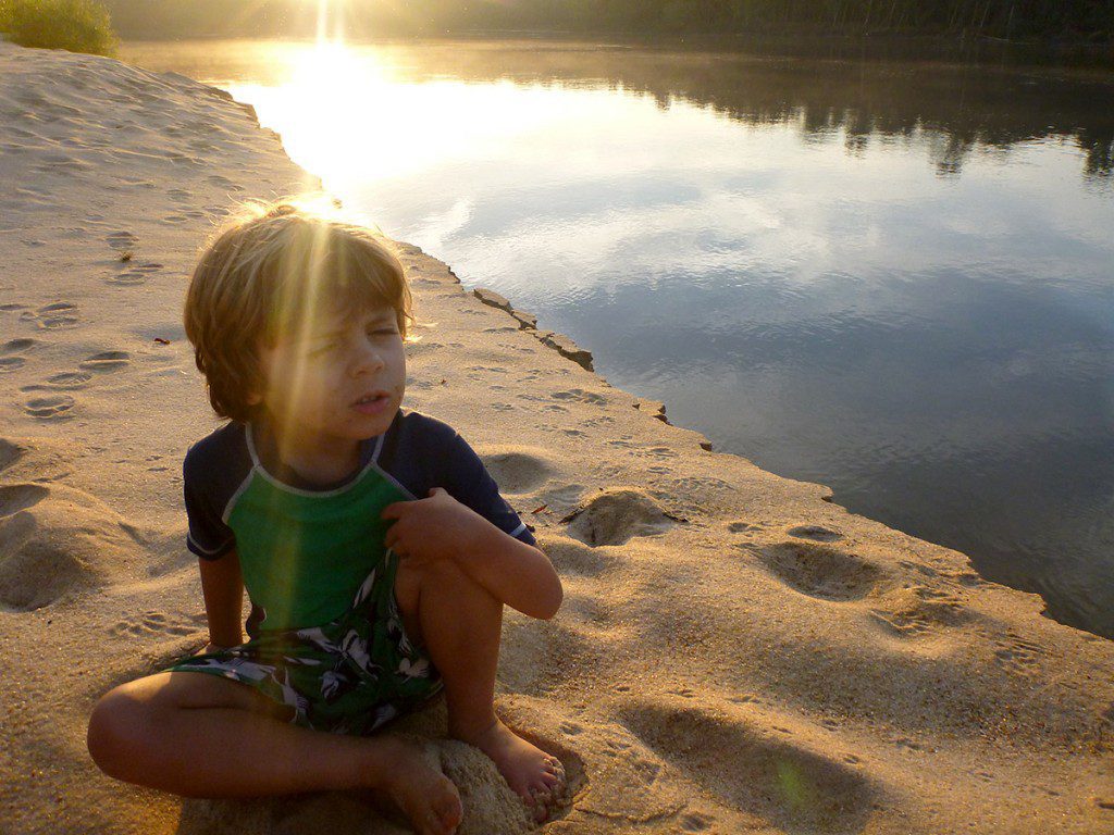 Max has a lot of deep pondering to do as the sun rises over the Apalachicola River. 