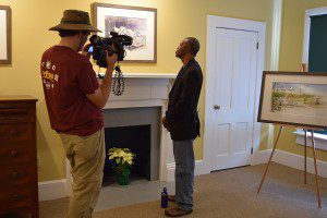 With WFSU Producer Rob Diaz de Villegas rolling video, Eluster Richardson talks about paintings he made for the Jones Tenant House display. In this gallery at Tall Timbers hang the original watercolors from which the displays were printed.