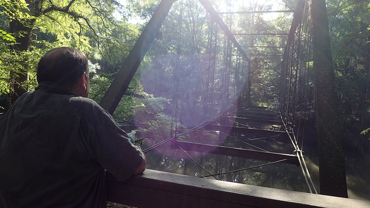 Dale Cox gazes out at Bellamy Bridge on the Upper Chipola River.