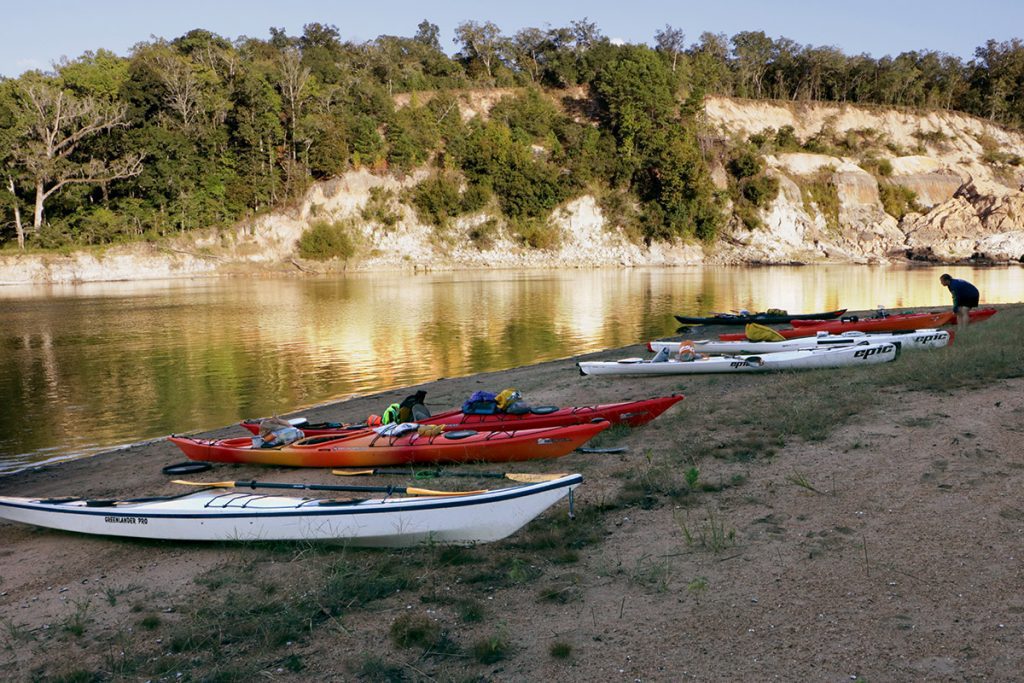Several kayaks parked on a sandbar across from Alum Bluff, Apalachicola River.