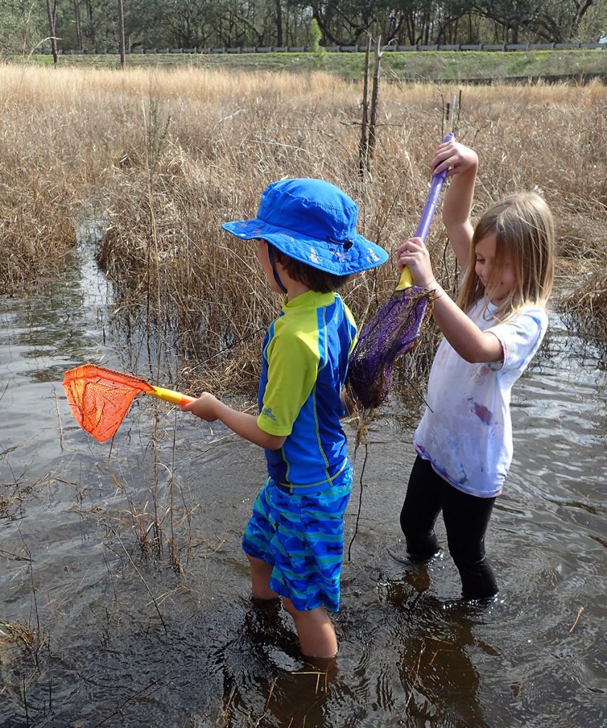 Max and Zoe diligently sample an ephemeral wetland during a February training session.