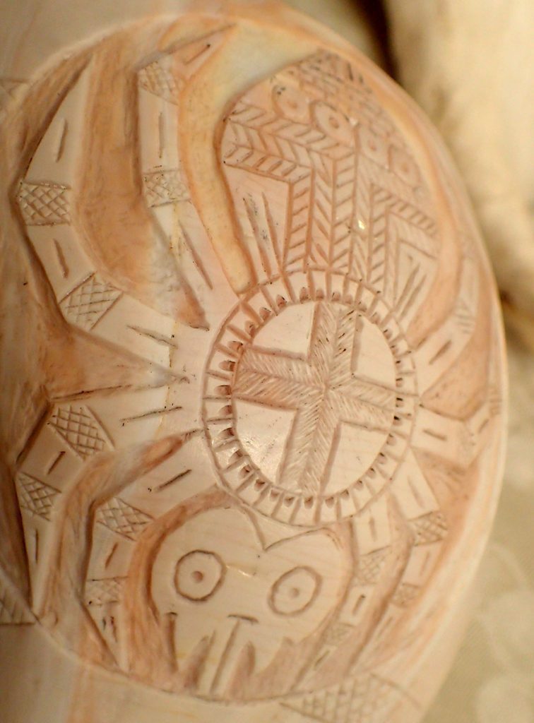 Medicine cup featuring grandmother weaver spider, adorned with a solar cross.